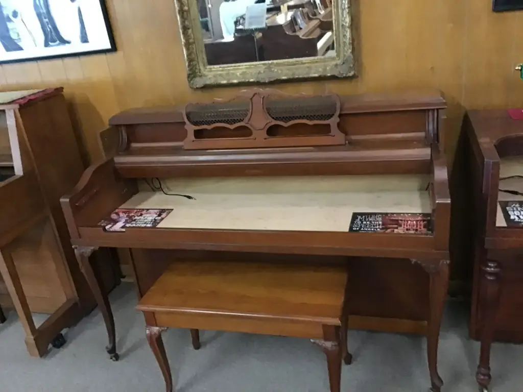 A console piano case rebuilt into a writing desk