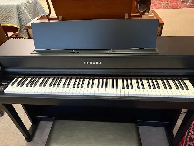 Close view of the weighted keybed on a Yamaha Clavinova digital piano